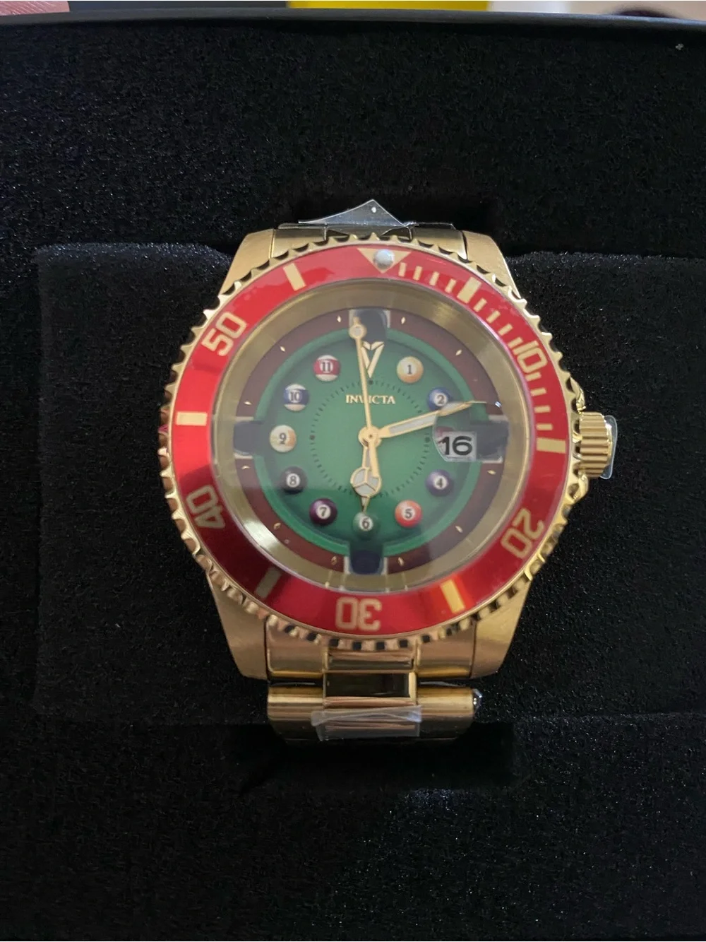 Invicta Gold Watch with Green Dial and Red Bezel